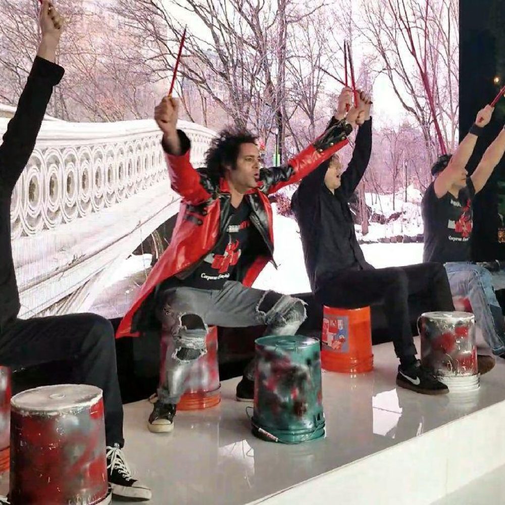 Industrial Rhythm bucket drummers perform on stage Industrial Rhythm bucket drummers perform on stage